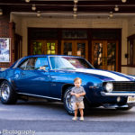 A boy, a car and a movie theater